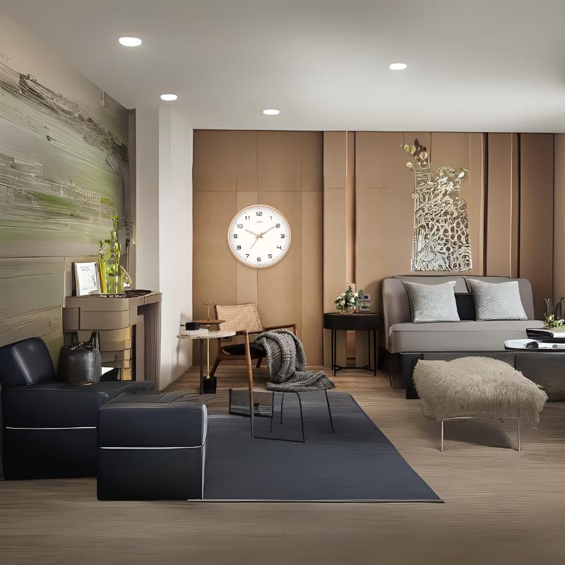 Chic contemporary living room with neutral tones, wall clock, cozy seating, and artistic decor – styled by The Niomi
